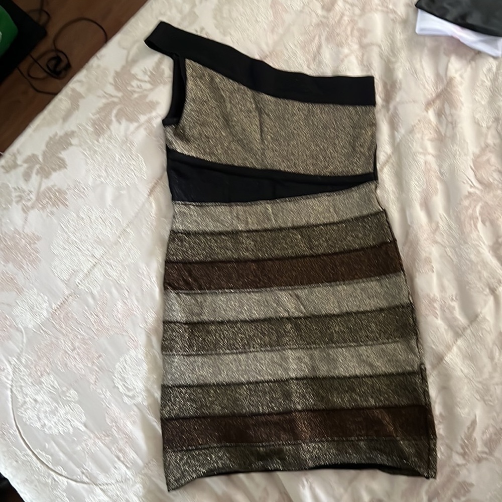 Size small Bebe bandage dress. Perfect for parties, hugs your curves perfectly.